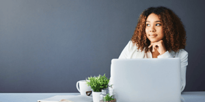 Woman on computer thinking