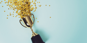 Trophy award with gold confetti